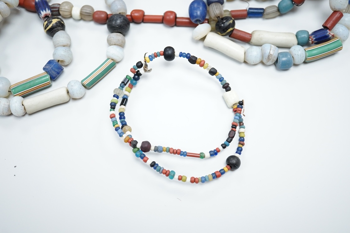 A pair of Turkish bath shoes, a collection of African beads and Middle Eastern vessels etc.